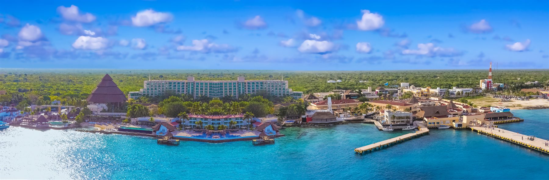 Aerial view of the Cozumel waterfront, its piers and turquoise Caribbean water